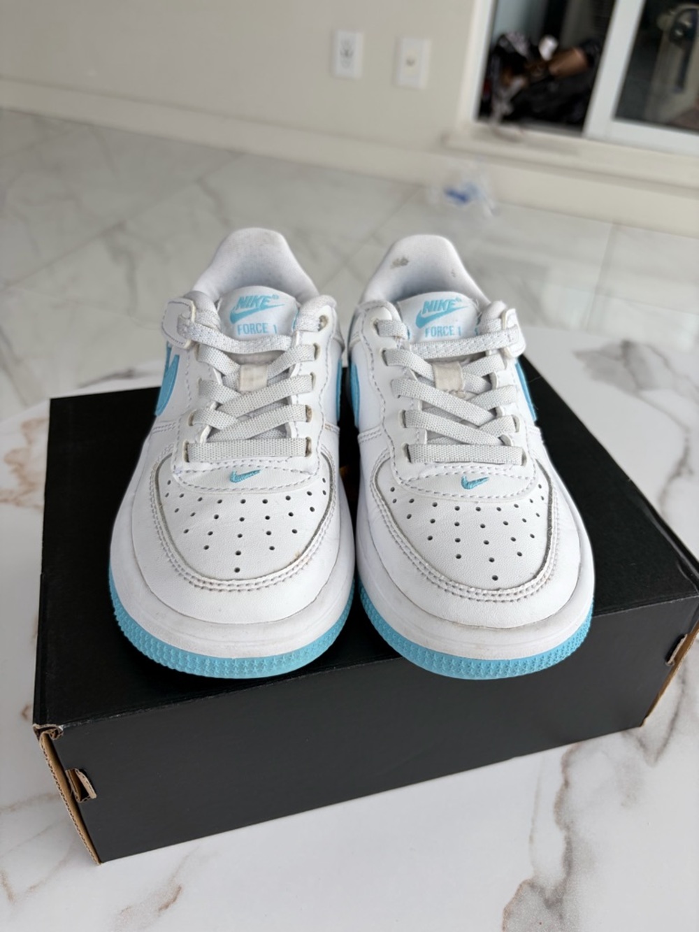 Nike Kids White Sneakers with Sky Blue Accents